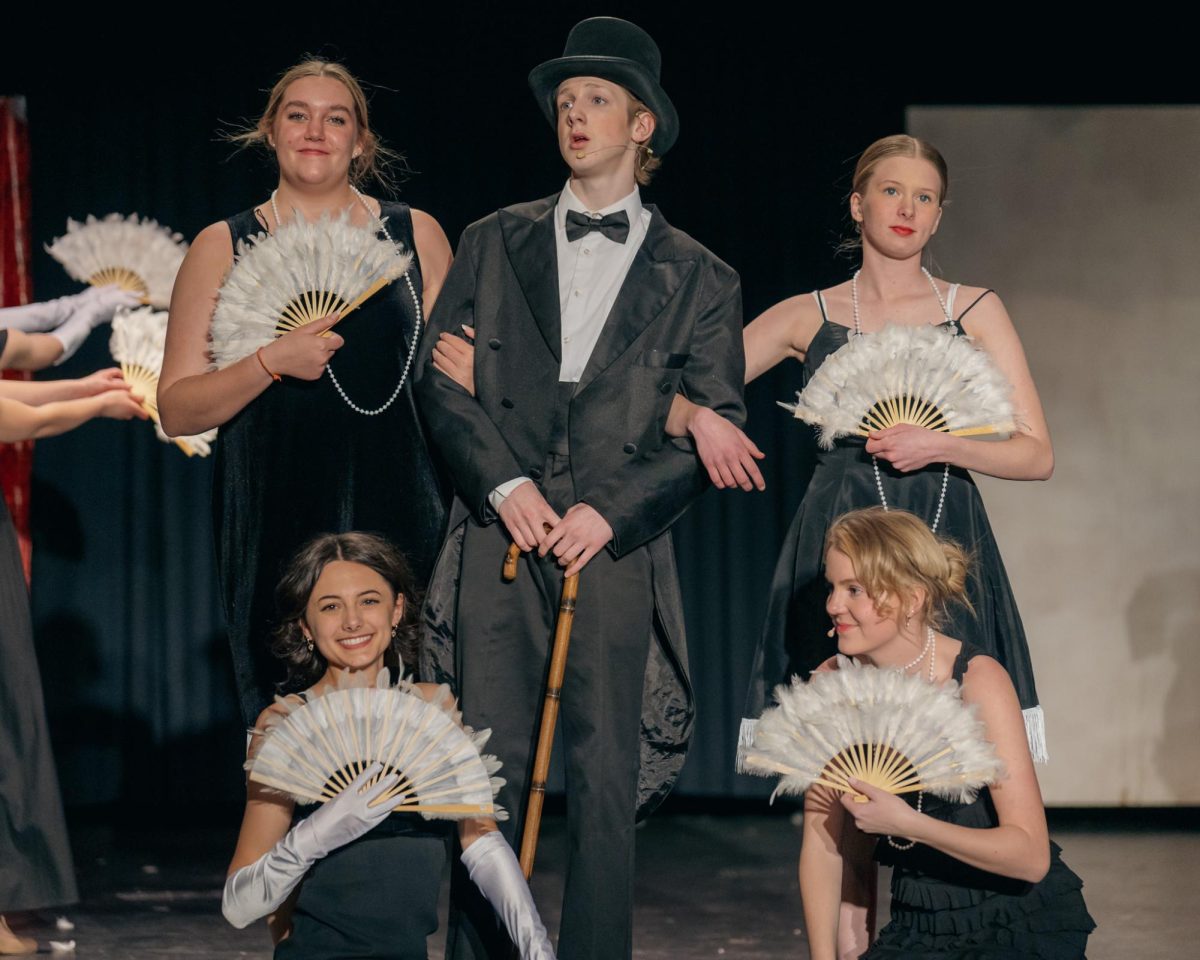 Maize High sophomore Lucas Gordon in "Singing in the Rain" with Triple Threat Theater.