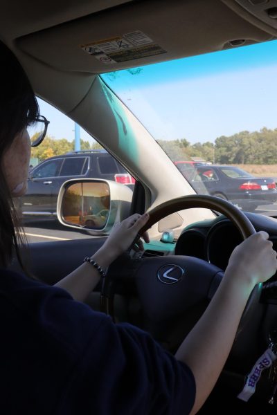 Photographer Jasey Fellers rides as a passenger as Johanna Spear drives.