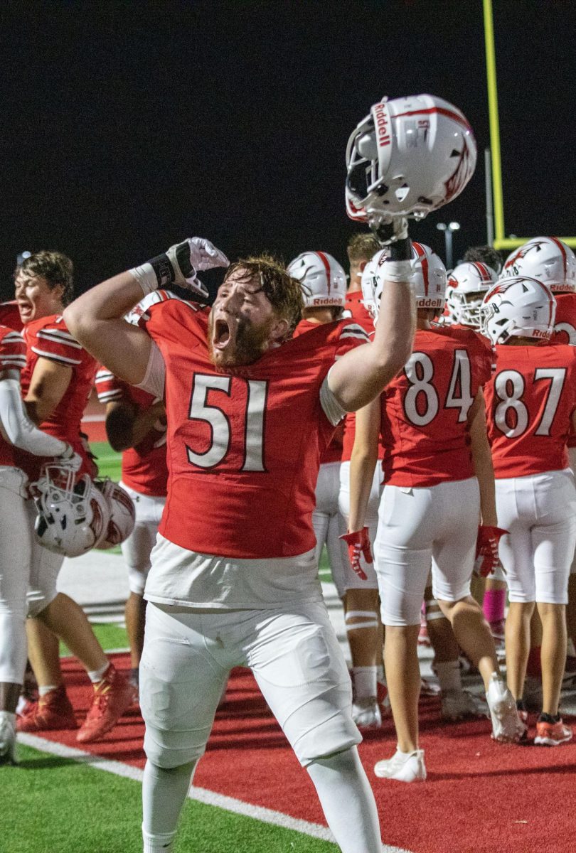 Senior Blake Chambers celebrates and hypes up the crowd because a touchdown had been scored.