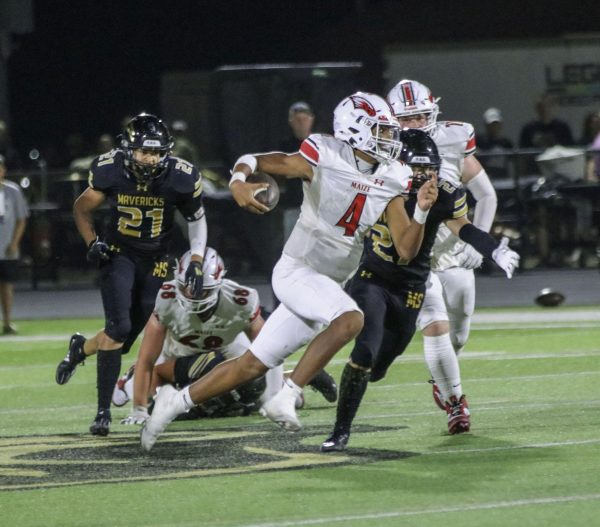 Junior Brayden Myovela attempts a run toward the end zone hoping to score a touchdown.