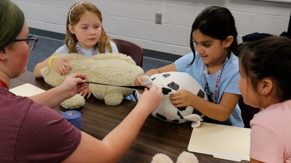 Maize and Maize South Elementary students participating in an activity with their teddy bears.