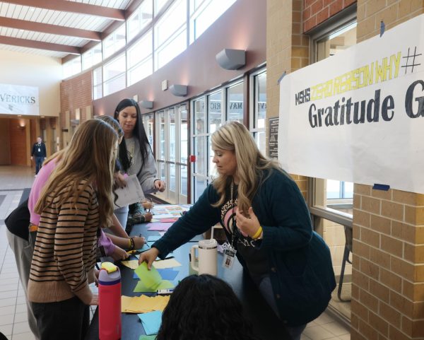 Mandy Herrman helps lead a ZeroReasonsWhy event at Maize South. She became the sponsor for the club this school year.