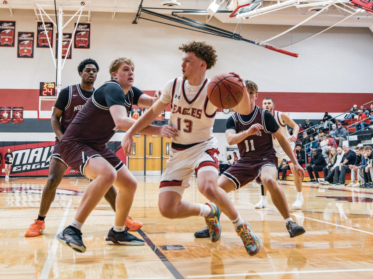 Photos: Maize stampedes Mustangs 71-54